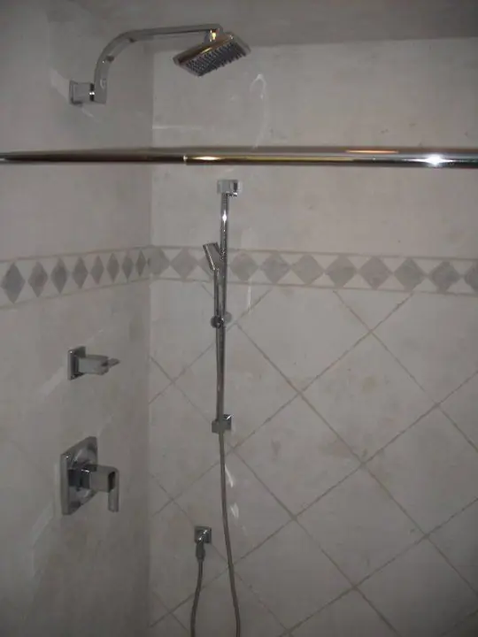 Chrome shower valve and rain head with a diamond tile accent band