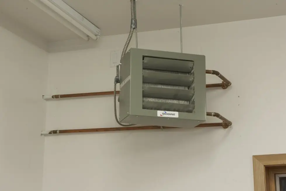 Modine gas fired hydronic unit heater installed in a shop with copper supply and return lines