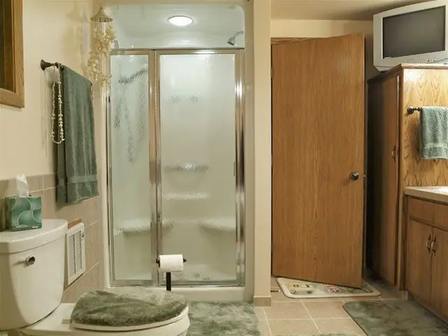 Finished bathroom with a glass sliding shower door installation